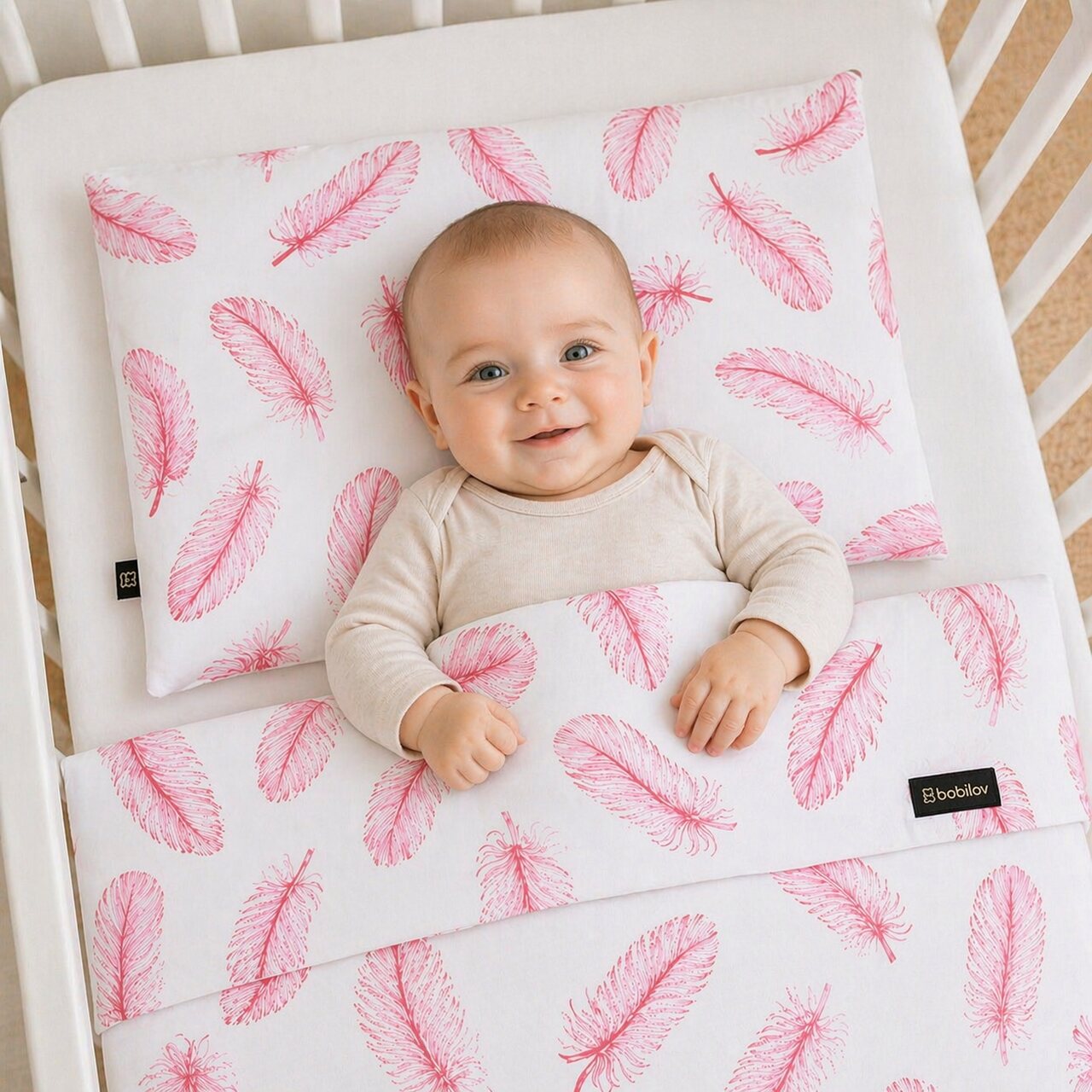 REVERSIBLE BABY BEDDING SET PINK FEATHERS 
